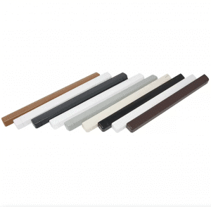 A collection of plastic rods in various colors on a plain backdrop, resembling trickle vents.