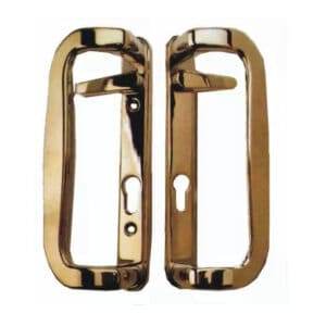 A pair of brass door handles on a timber sliding door.